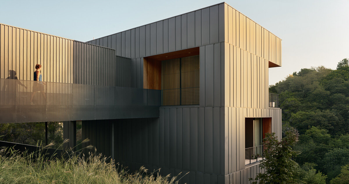 alterstudio's falcon ledge residence climbs steep ravine in austin