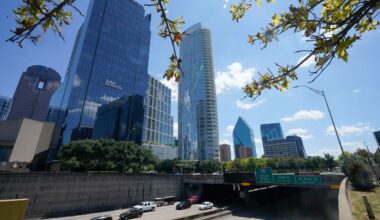 Light afternoon traffic flows in downtown Dallas, Thursday, Aug. 12, 2021. (AP Photo/LM Otero)