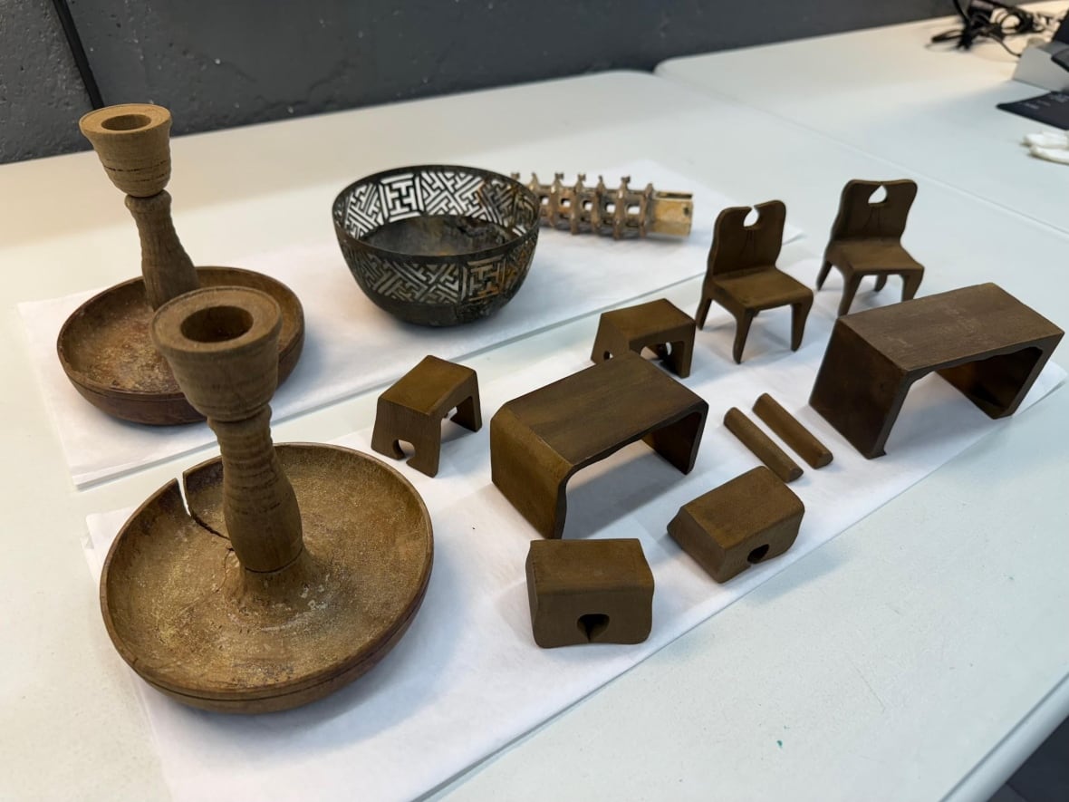 A table with several artifacts made of wood 