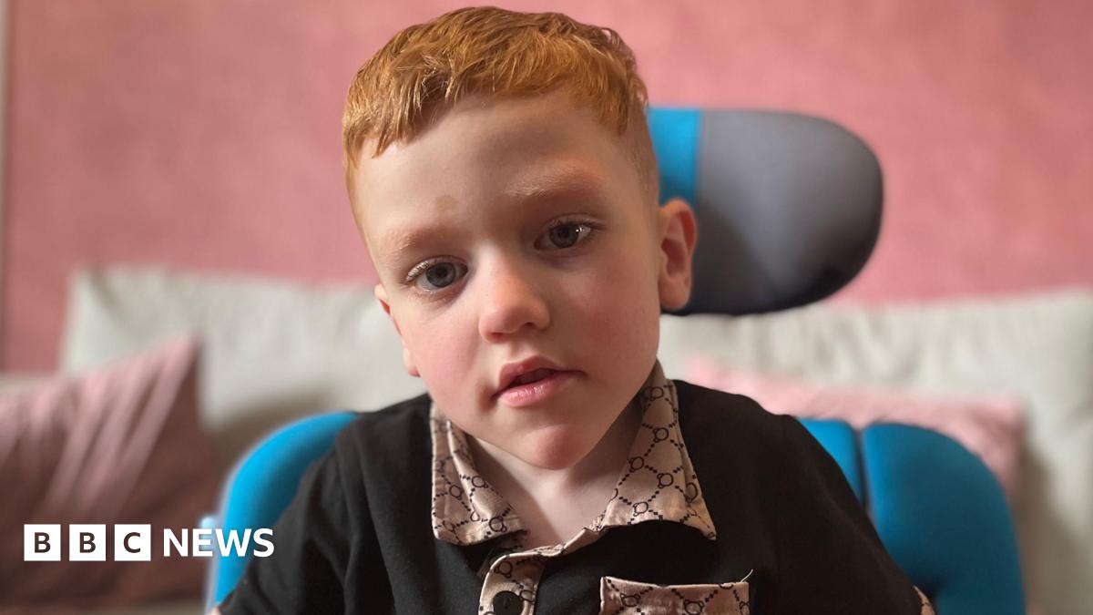 Image of Harrison looking at the camera in his wheelchair.
