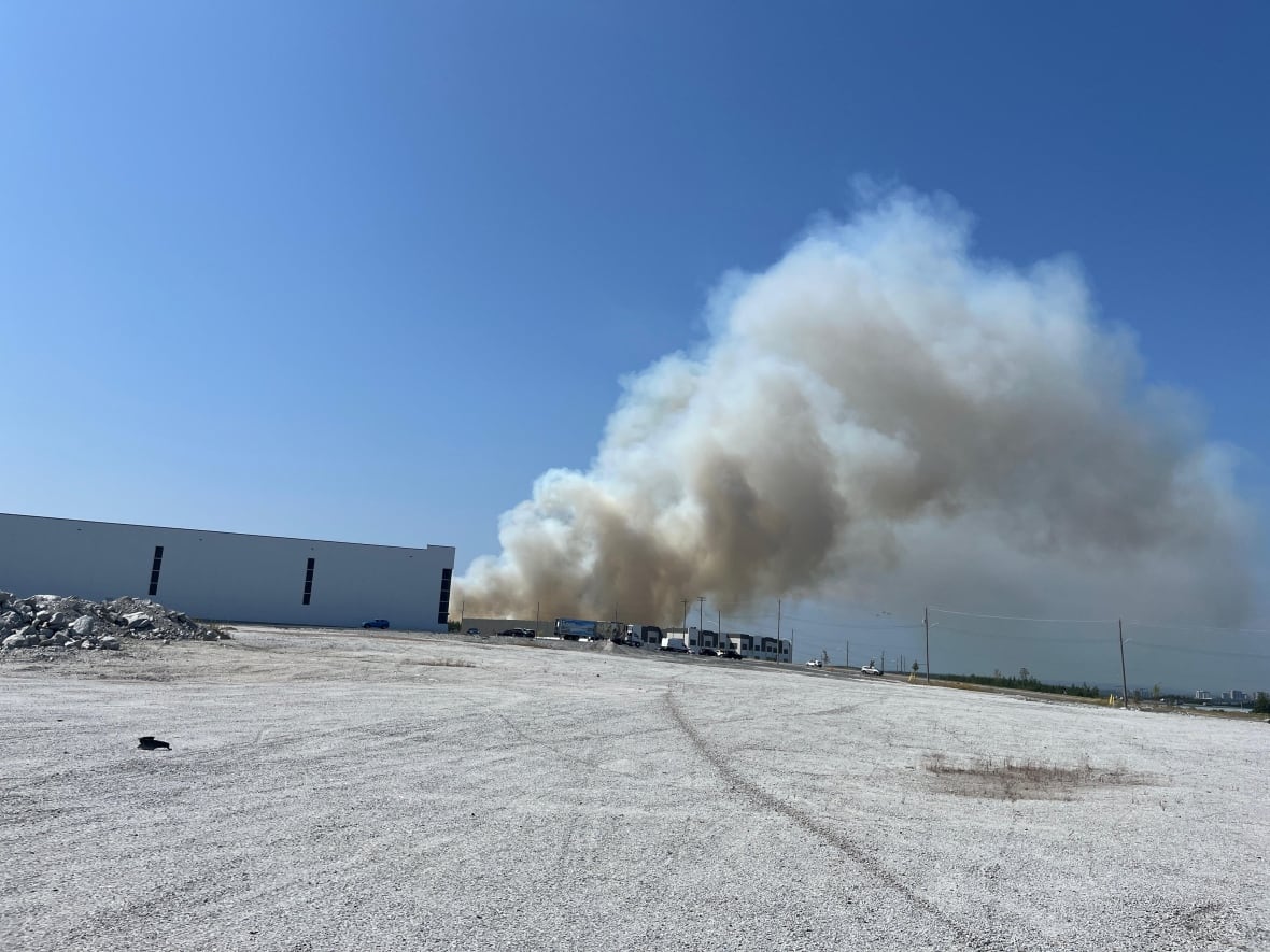 Smoke behind a building