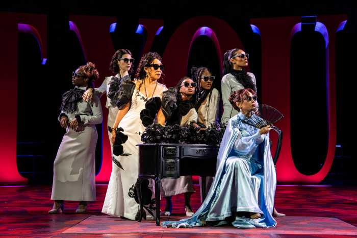 Daphne Rubin-Vega (seated), Sandra Oh (center back), and members of the ensemble in the Free Shakespeare in the Park production of 'Twelfth Night.'