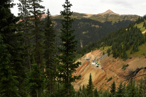 The Gold King Mine can be seen from above on August 17, 2016 near Silverton, Colorado. A mining and safety team contracted by the Environmental Protection Agency is working on the mine north of Silverton with heavy equipment to secure and consolidate a safe way to enter the mine and access contaminated water. The project intends to pump and treat the water to reduce metal pollution flowing out of the mine into Cement Creek. Just over a year ago on August 5th, 2015, workers with Environmental Restoration, a company based out of St. Louis, accidentally hit a wall in the opening of the mine releasing what turned out to be 3 million gallons of contaminated wastewater into Cement Creek below the mine and ultimately into the Animas river. The contaminated water carried high concentrations of iron, aluminum, cadmium, zinc, copper and arsenic.