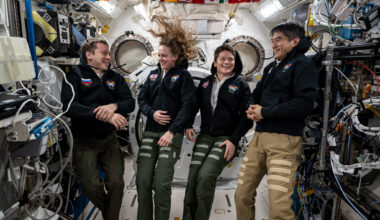 NASA's SpaceX Crew-10 members Kirill Peskov of Roscosmos, NASA astronauts Nichole Ayers and Anne McClain, and JAXA (Japan Aerospace Exploration Agency) astronaut Takuya Onishi share a light moment during a group portrait inside the International Space Station's Kibo laboratory module.
