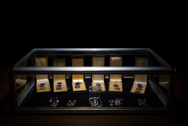 Eleven Purple Heart medals awarded to Illinois veterans that ended up in the unclaimed property section vault of the Illinois Treasurer's Office, shown on Oct. 15, 2024, were part of Operation Purple Heart. (E. Jason Wambsgans/Chicago Tribune)