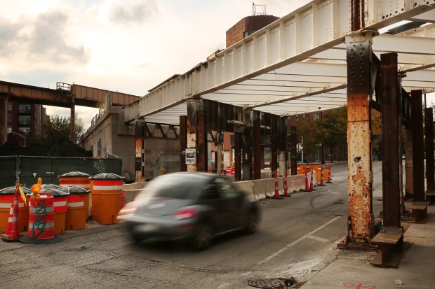 A car passes beneath a former rail bridge, currently one...