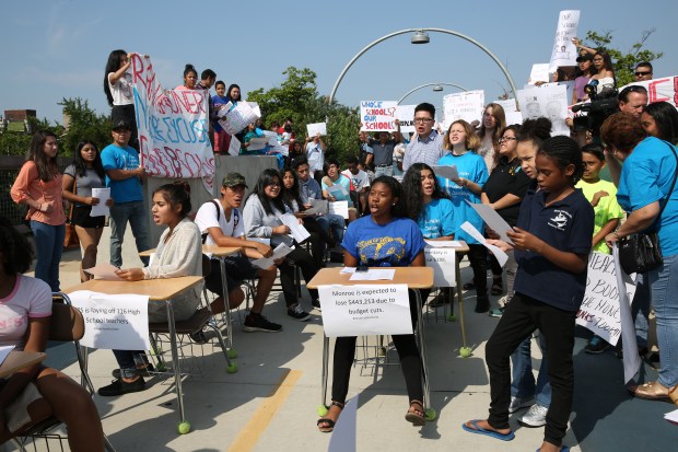 The Logan Square Neighborhood Association joins area schoolchildren and set...