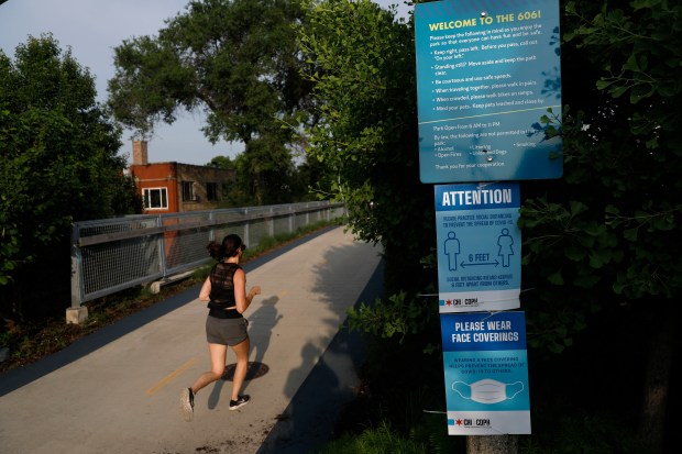 Runners and walkers use The 606 trail, June 22, 2020,...