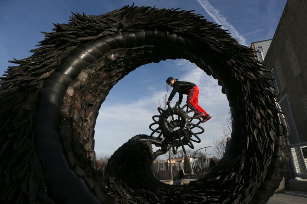 Gracie Lynn, 8, of Chicago plays on a large rubber...