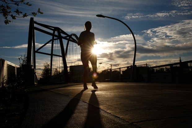 A jogger runs on The 606 trail near Milwaukee and...
