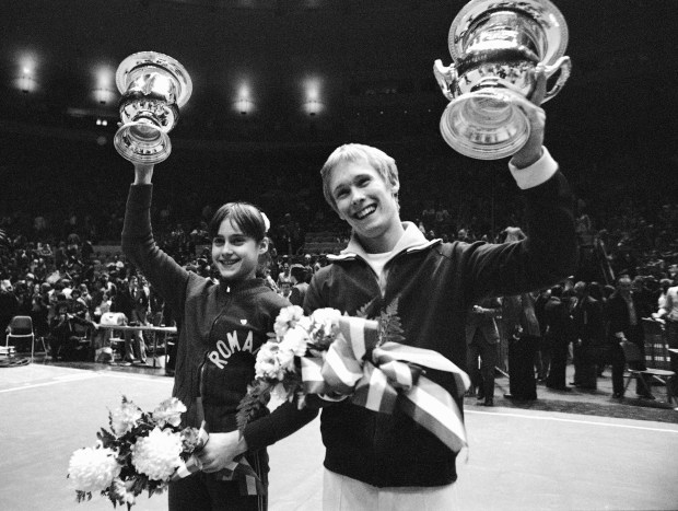 Romania's Nadia Comaneci and Bart Conner, of Morton Grove, hold trophies on March 28, 1976, after being awarded the American Cup International Gymnastics Competition at New York's Madison Square Garden. They married twenty years later. (Suzanne Vlamis/AP)