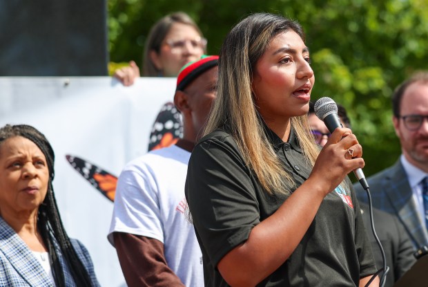 Giselle Rodriguez of Illinois Workers in Action, speaks in opposition to President Trump's intention to stage ICE agents at Naval Station Great Lakes in Sept., during a protests at the Veterans Memorial on Aug. 29, 2025, in North Chicago. (Stacey Wescott/Chicago Tribune)
