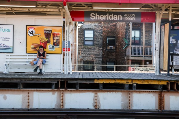 A passenger waits for a Red Line CTA train at the Sheridan station in Uptown on Aug. 21, 2025. The station hasn't been upgraded. (Eileen T. Meslar/Chicago Tribune)