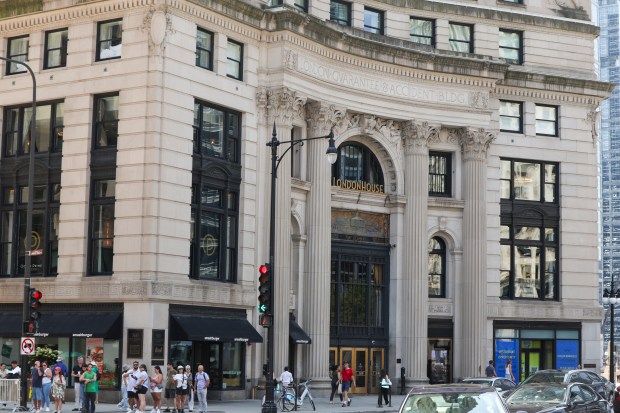 People walk past LondonHouse Chicago in the Loop, July 29, 2025. (Eileen T. Meslar/Chicago Tribune)