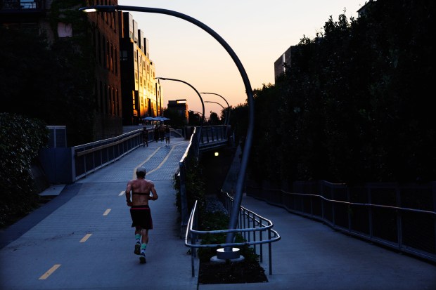 A person runs on The 606 trail on Aug. 14,...