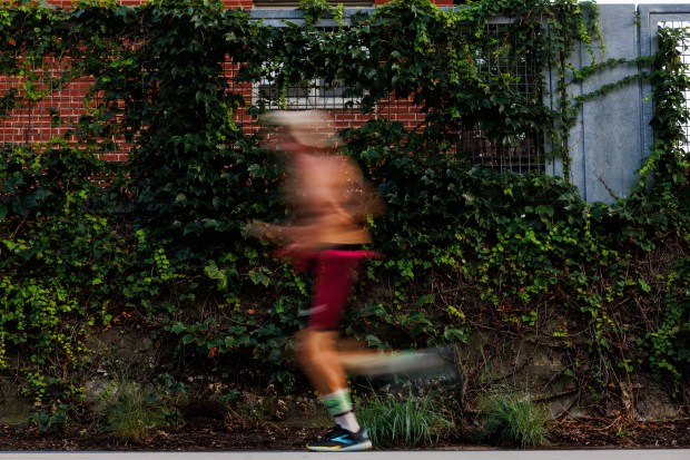 A person runs on The 606 trail on Aug. 14,...