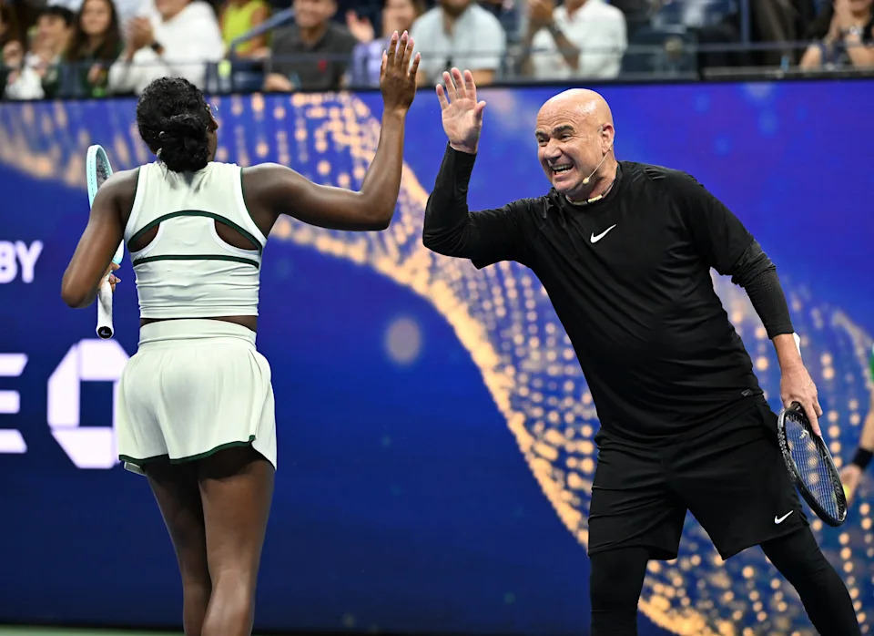 FLUSHING NY- AUGUST 21: Coco Gauff and Andre Agassi are during The Stars Of The Open exhibition match on Arthur Ashe Stadium at the USTA Billie Jean King National Tennis Center on August 21, 2025 in Flushing Queens. Credit: mpi04/MediaPunch /IPX