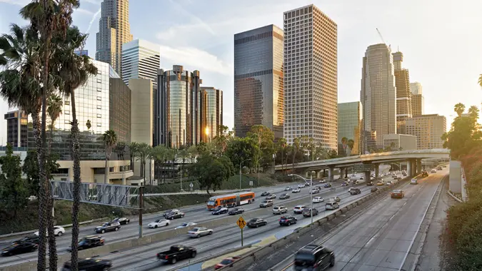 Downtown Los Angeles in the early evening with commute traffic in stock photo.