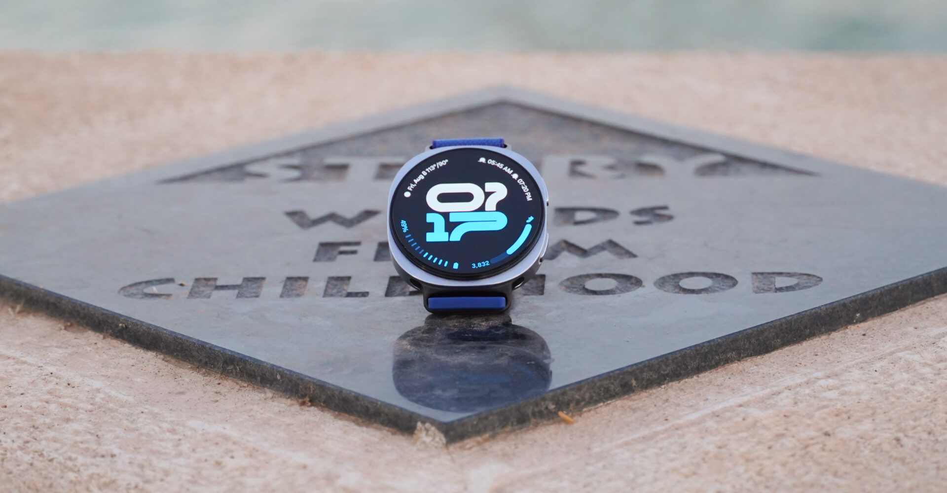 The Samsung Galaxy Watch 8 showing an athletic watch face on a plaque.