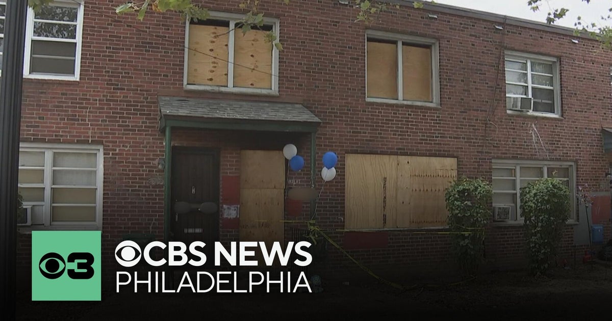Memorial outside of a North Philadelphia home where a fire killed a 12-year-old boy