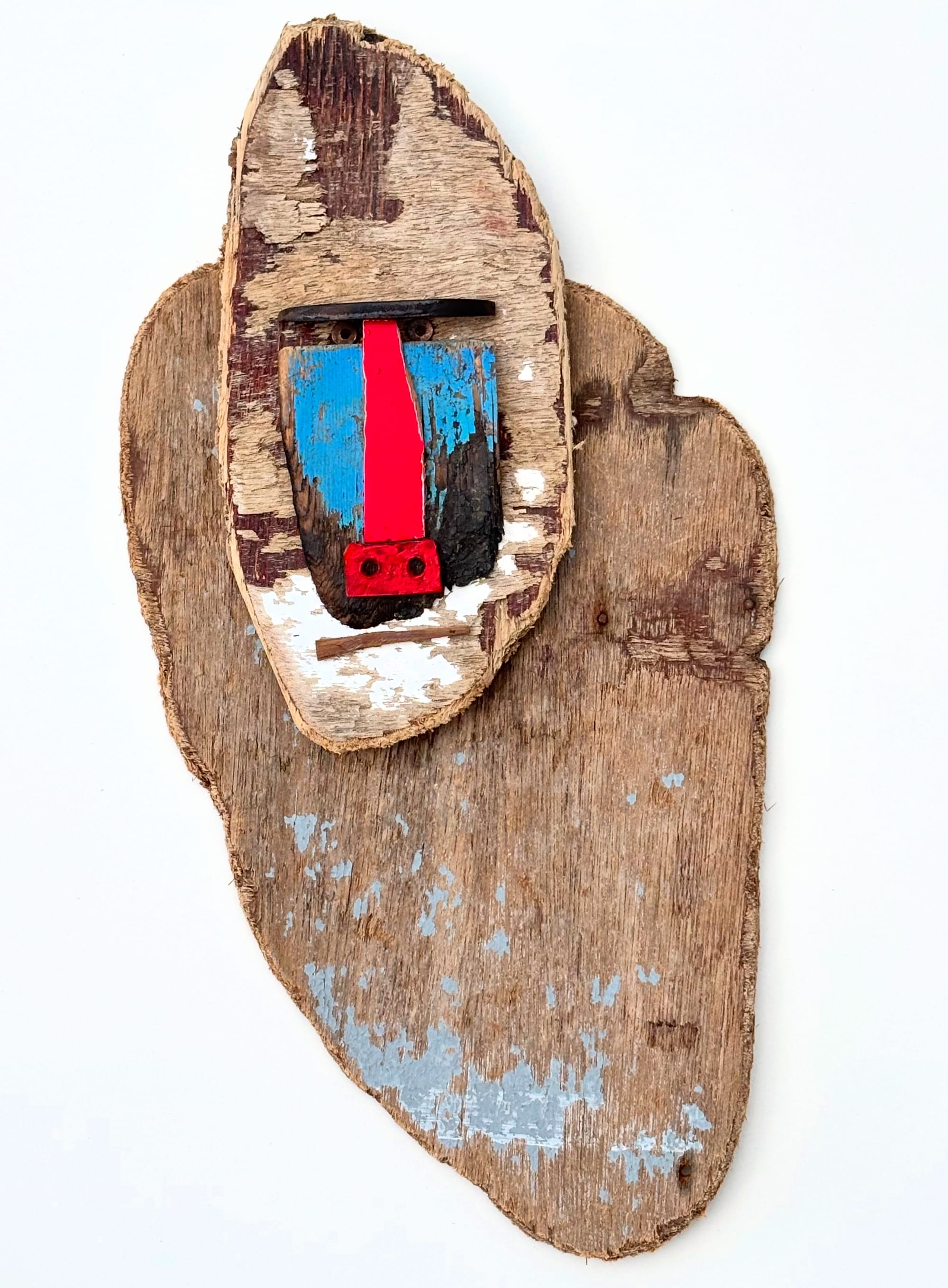 a monkey sculpture made of worn wood