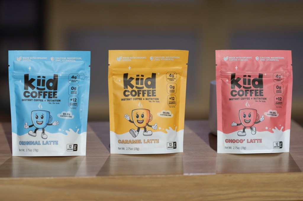 Three pouches of Kiid Coffee, in original, caramel, and chocolate flavors.