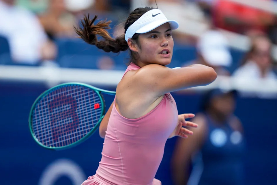 Aug 11, 2025; Cincinnati, OH, USA; Emma Raducanu (GBR) returns a shot against Aryna Sabalenka (BLR) during the Cincinnati Open at the Lindner Family Tennis Center.© Aaron Doster-Imagn Images