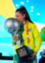 Trophy in hand, GEF Champions Circle alum, Monik Bisoni marks Brazil’s triumph in eFootball™. Photo: Ben Queenborough/GEF