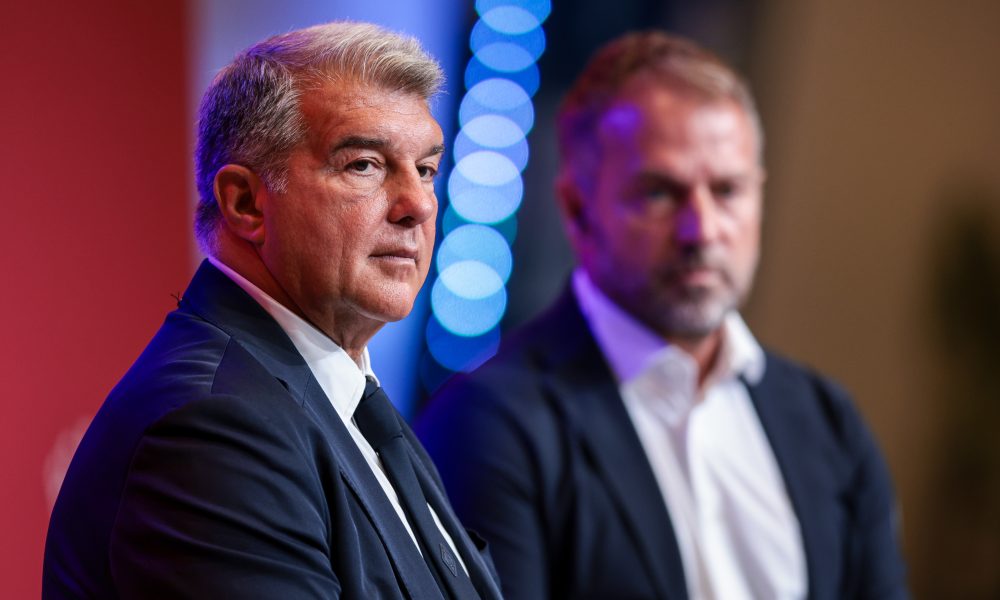 BARCELONA, SPAIN - JULY 25: New FC Barcelona Head Coach Hansi Flick (R) and Joan Laporta, President of FC Barcelona pose for a photo during a press conference at Spotify Camp Nou on July 25, 2024 in Barcelona, Spain. (Photo by Eric Alonso/Getty Images)