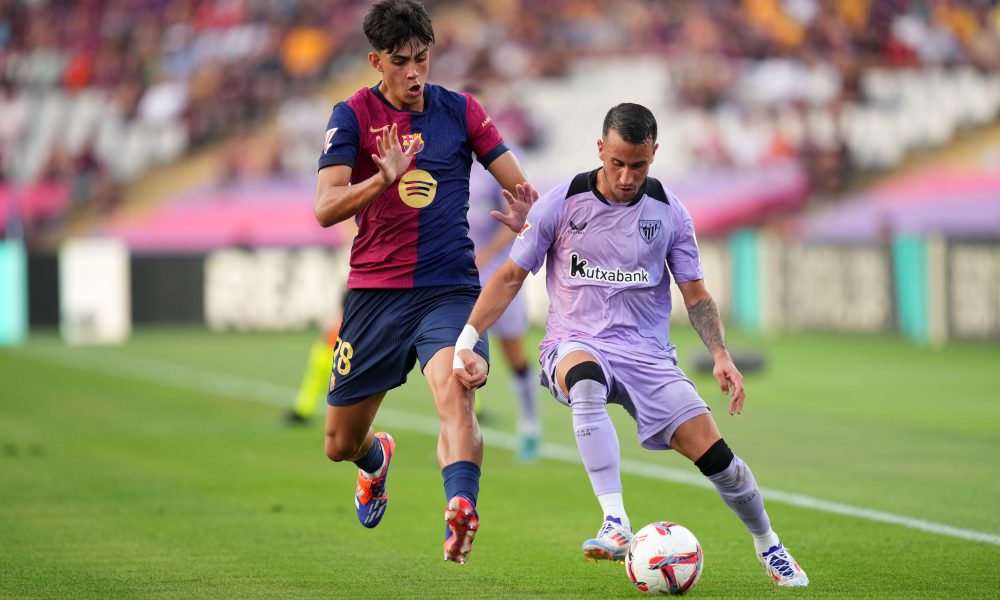 BARCELONA, SPAIN - AUGUST 24: Alex Berenguer of Athletic Club is challenged by Marc Bernal of FC Barcelona during the La Liga match between FC Barcelona and Athletic Club at Camp Nou on August 24, 2024 in Barcelona, Spain. (Photo by Alex Caparros/Getty Images)