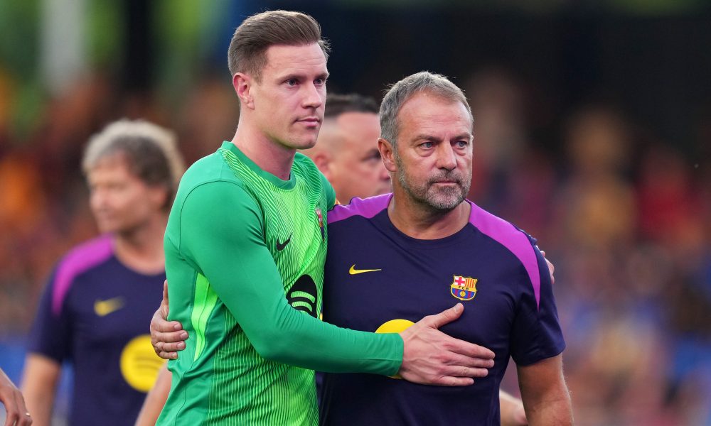 BARCELONA, SPAIN - AUGUST 10: Marc-Andre Ter Stegen of FC Barcelona embraces Hansi Flick, Head Coach of FC Barcelona prior to the Joan Gamper Trophy match between FC Barcelona and Como1907 at Estadi Johan Cruyff on August 10, 2025 in Barcelona, Spain. (Photo by Alex Caparros/Getty Images)