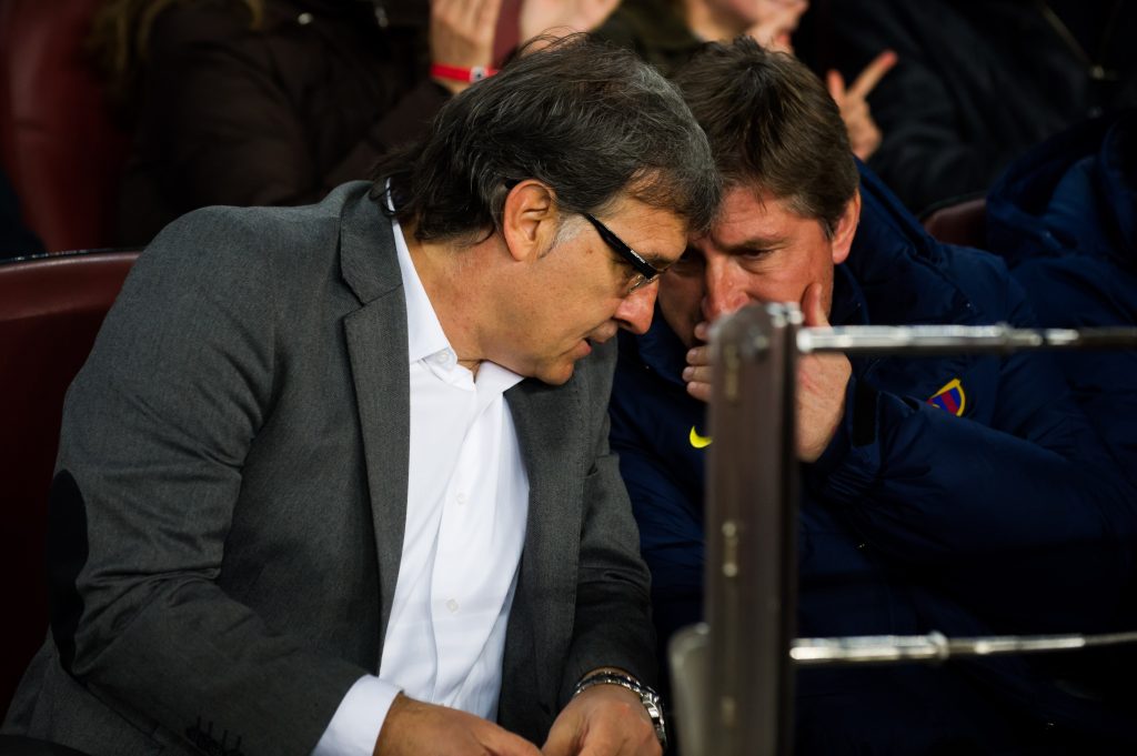 BARCELONA, SPAIN - MARCH 02: Head coach of FC Barcelona Gerardo 'Tata' Martino speaks with his assistant Jordi Roura during the La Liga match between FC Barcelona and UD Almeria at Camp Nou on March 2, 2014 in Barcelona, Spain.  (Photo by Alex Caparros/Getty Images)