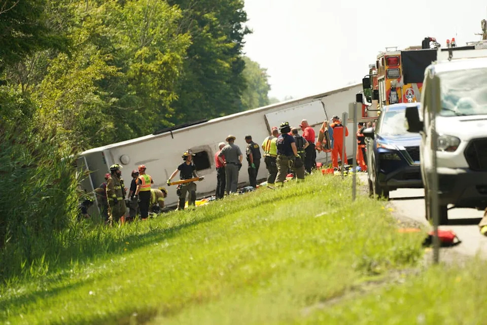 First responders work to rescue victims at the scene of a tour bus that crashed and rolled over on the New York State Thruway near Pembroke, New York, on Friday, Aug. 22, 2025. / Credit: Libby March / AP