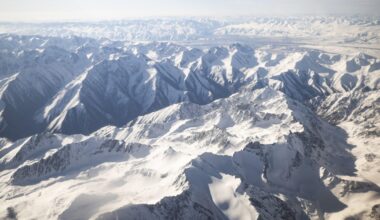 Climber dies trying to rescue injured Russian woman from Kyrgystan's highest mountain; search halted