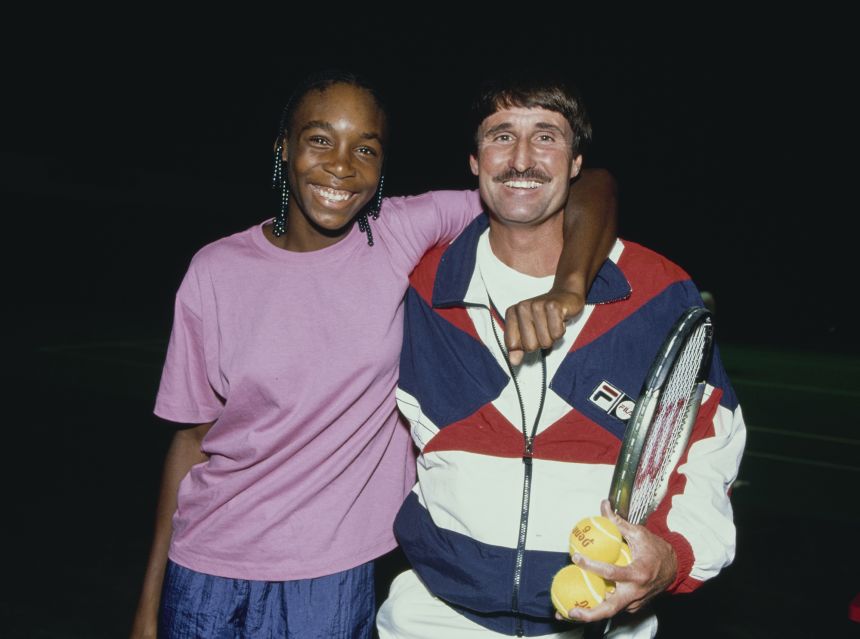 Venus poses for a photograph with childhood coach Rick Macci in 1994.