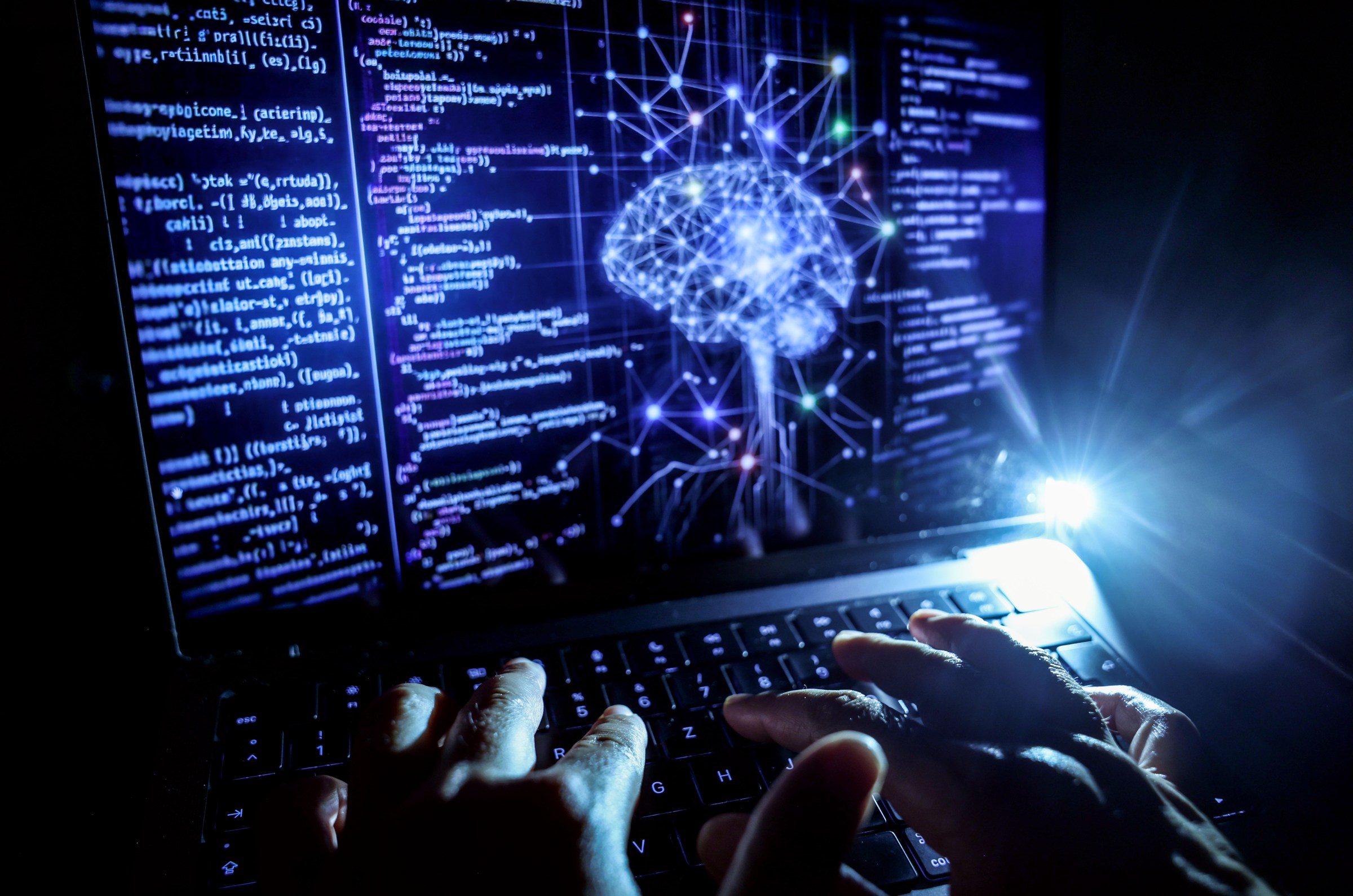 A person works at a computer with an illustrative image generated by artificial intelligence on the screen, showing code from various programming languages and a neural network diagram. 