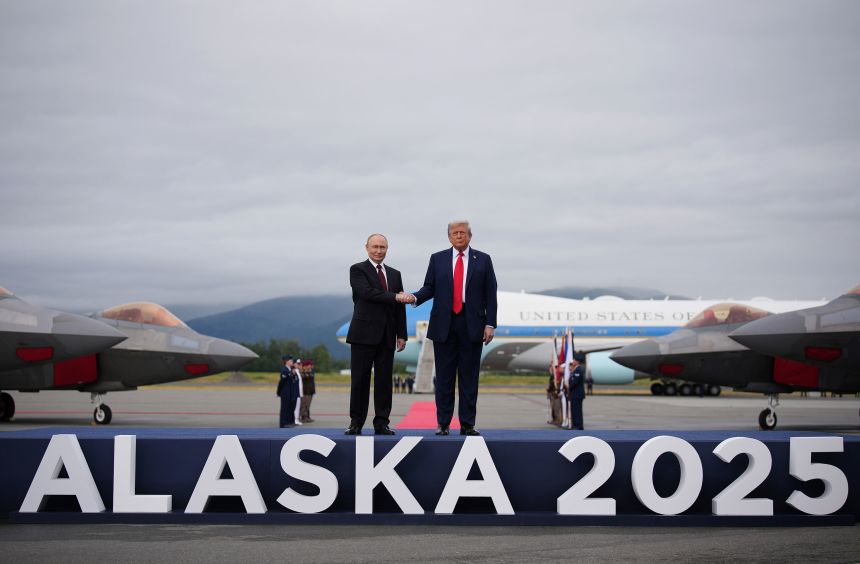 US President Donald Trump greets Russian President Vladimir Putin