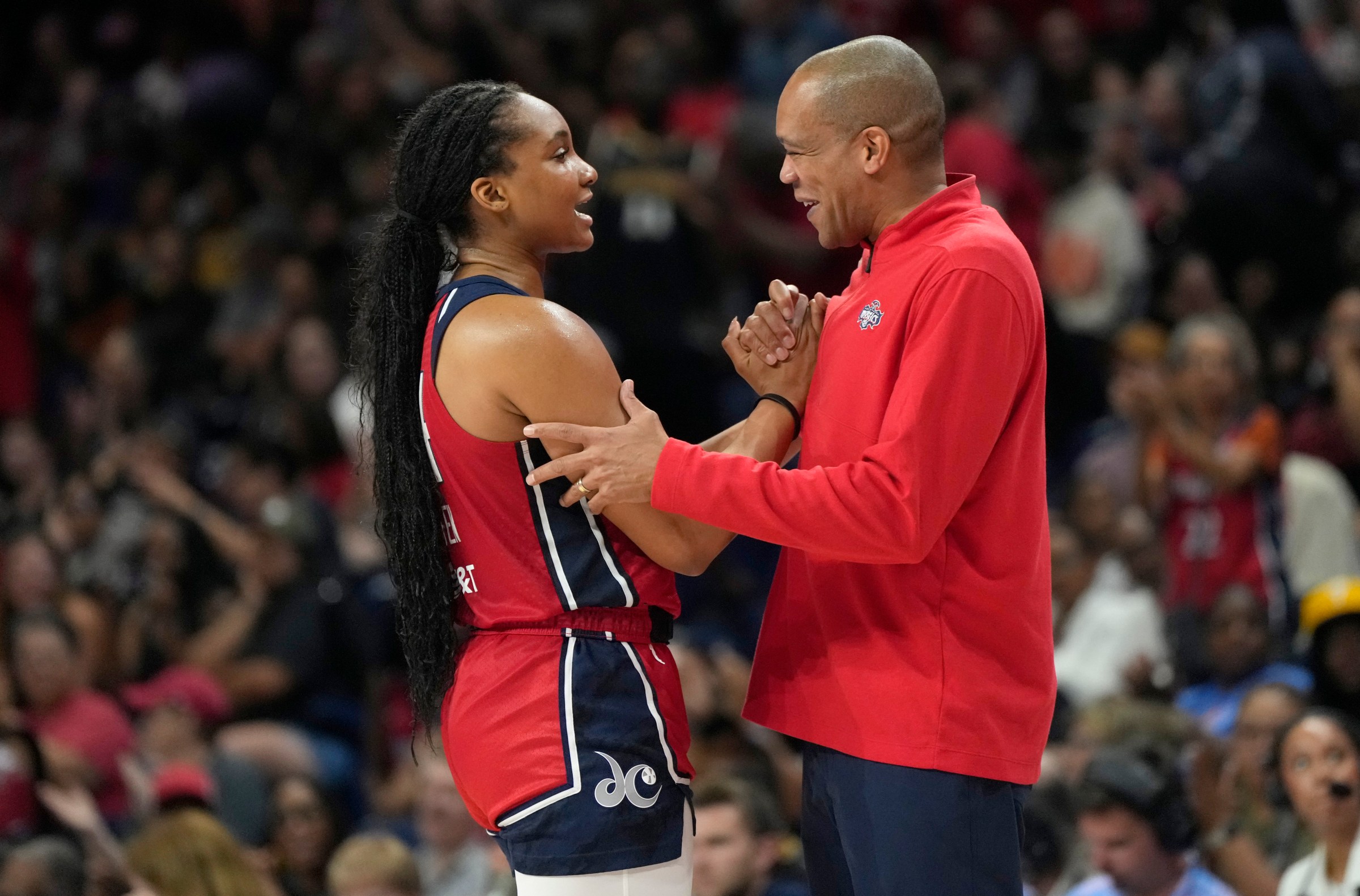 Kiki Iriafen and head coach Sydney Johnson.