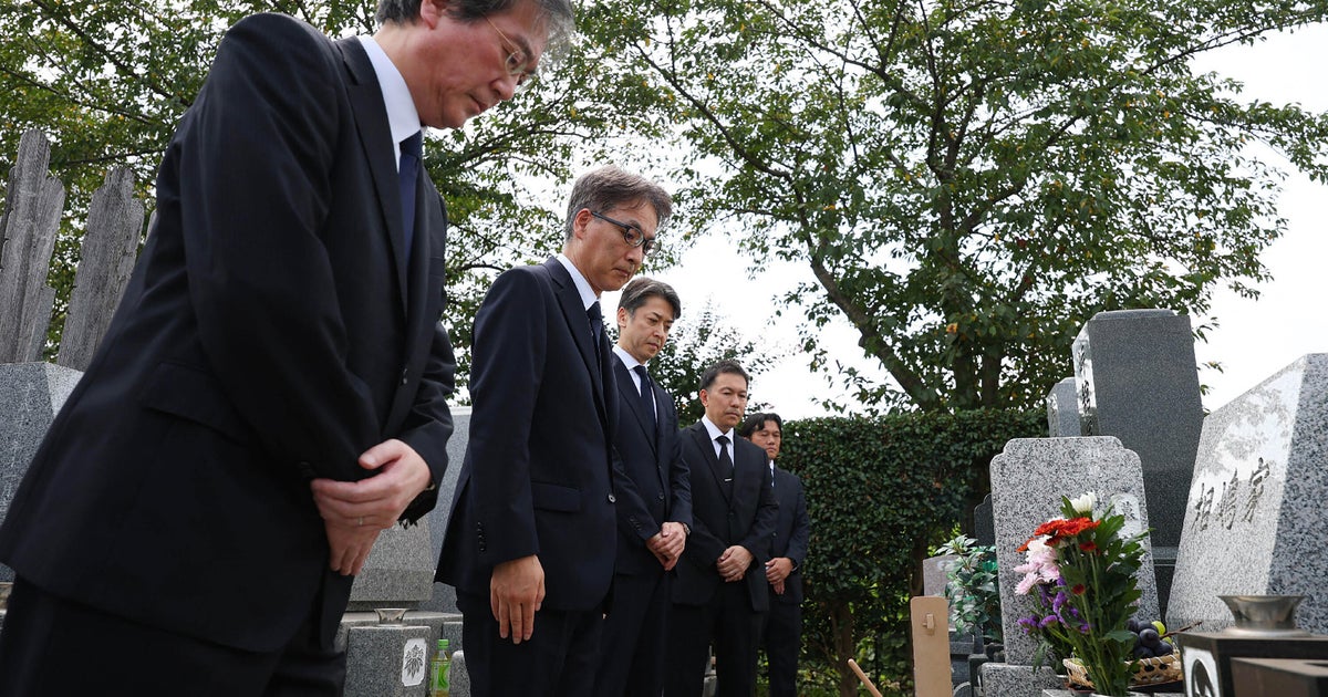Police apologize at grave of Japanese businessman who was wrongfully arrested and died after long detention