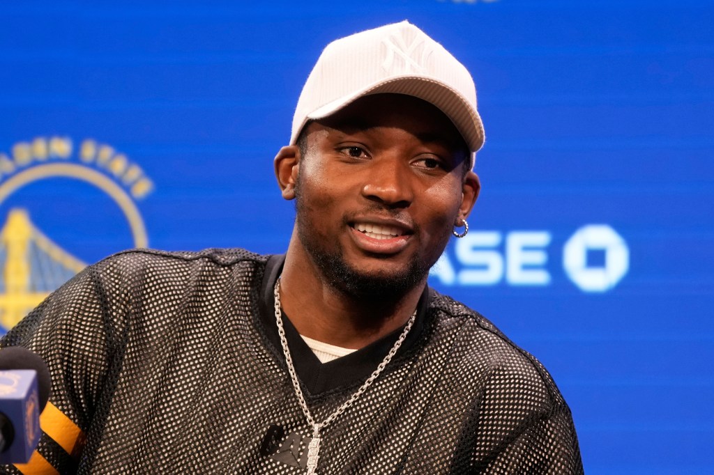 Jonathan Kuminga at a press conference.
