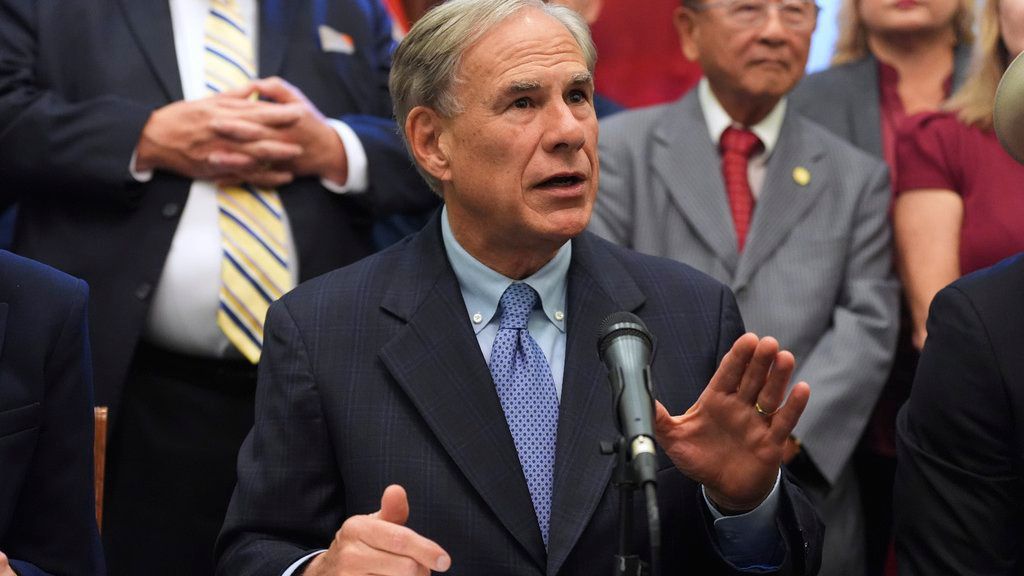 Texas Gov. Greg Abbott speaks to the media following a bill signing as Texas senators debate a bill on a redrawn U.S. congressional map during a special session in the Senate Chamber at the Texas Capitol in Austin, Texas, Friday, Aug. 22, 2025. (AP Photo/Eric Gay)