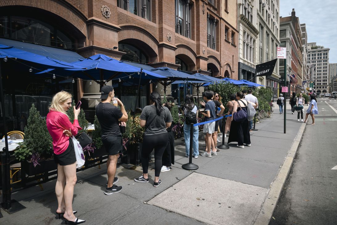 A line forms outside of New York's Lafayette cafe and bakery, famous for its Suprême Croissant.