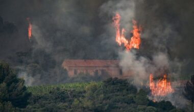 Flames billow from a forest fire near Saint Laurent de la Cabrerisse in Aude, France