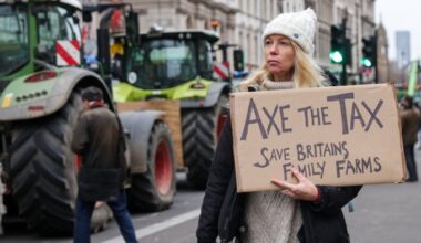 A protester holds a placard on Whitehall, Westminster in central London during the farmers protest in December 2024