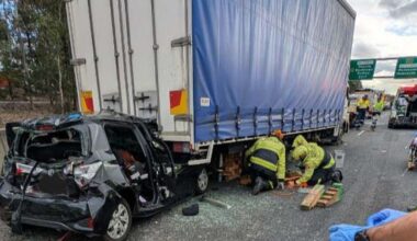Woman trapped in car between two trucks after horror Sydney crash