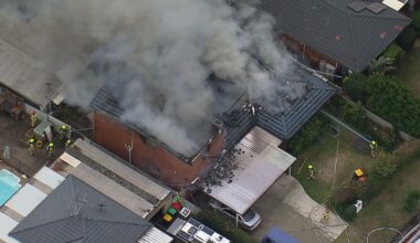 Firefighters battle to control house fire in western Sydney