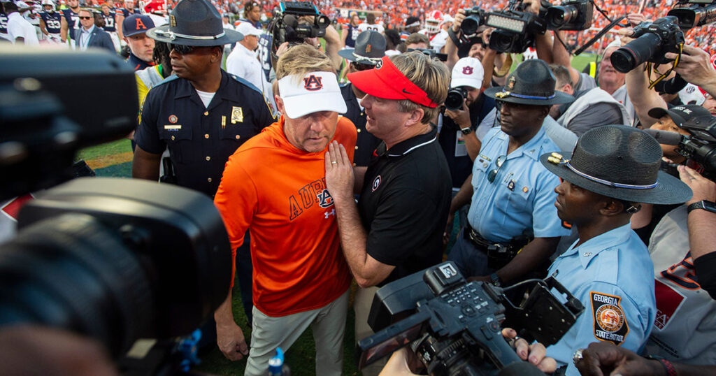 Auburn head coach Hugh Freeze and Georgia head coach Kirby Smart