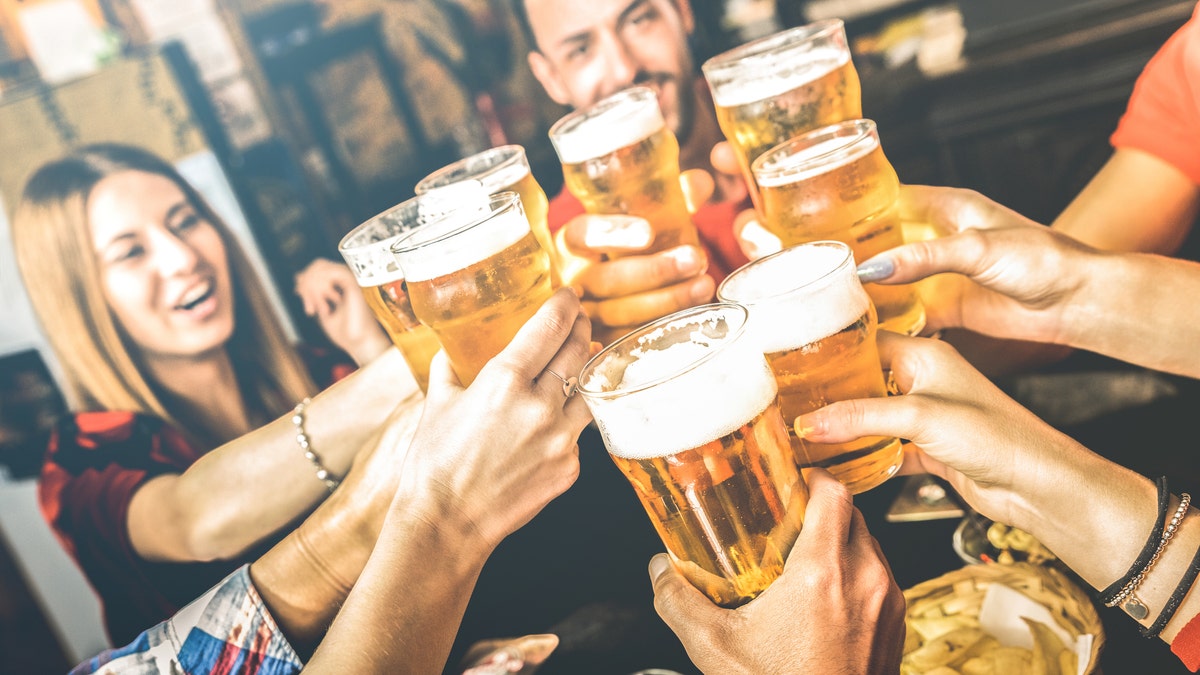 friends clinking beer glasses