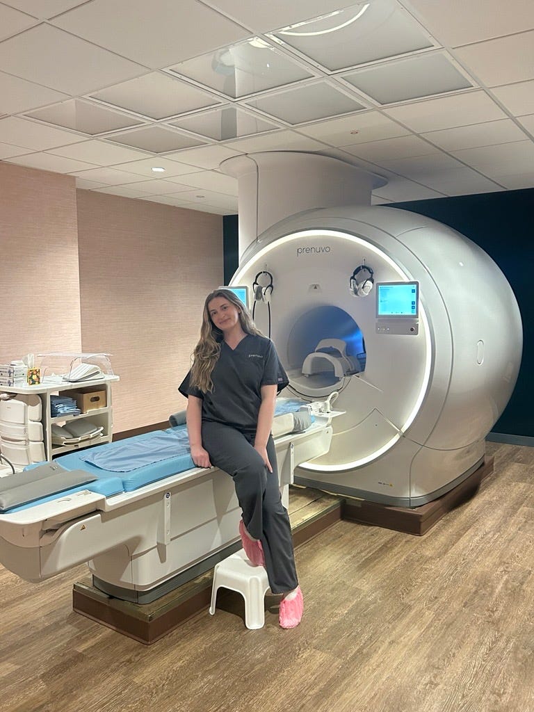 Woman standing in diagnostic imaging room featuring a Prenuvo MRI machine woman standing in diagnostic imaging room featuring a prenuvo mri machine