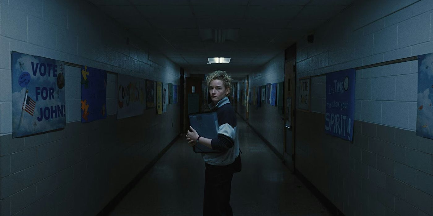 Julia Garner standing in a school corridor in Zach Cregger's horror movie Weapons